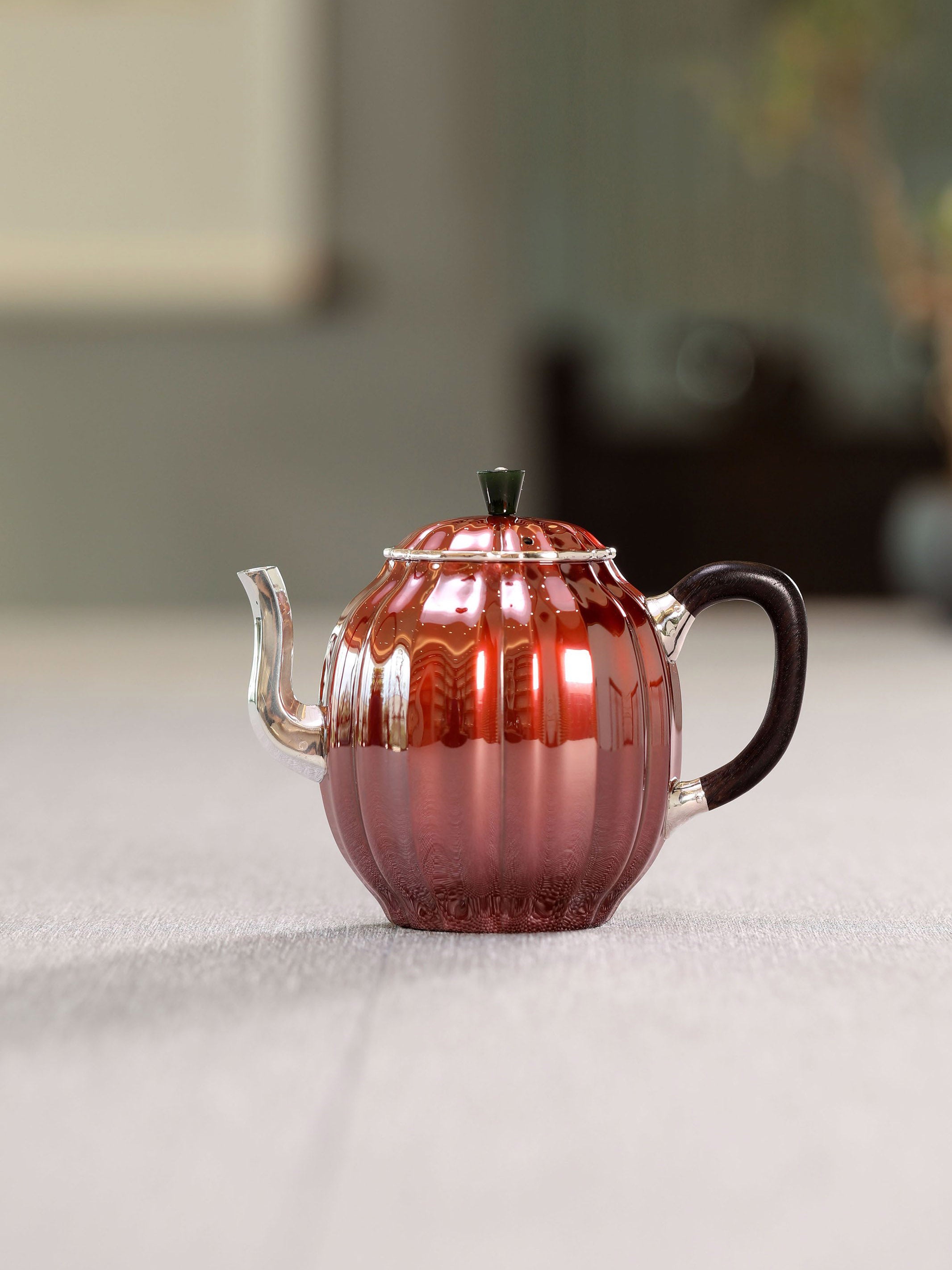 Diamond-shaped sterling silver teapot