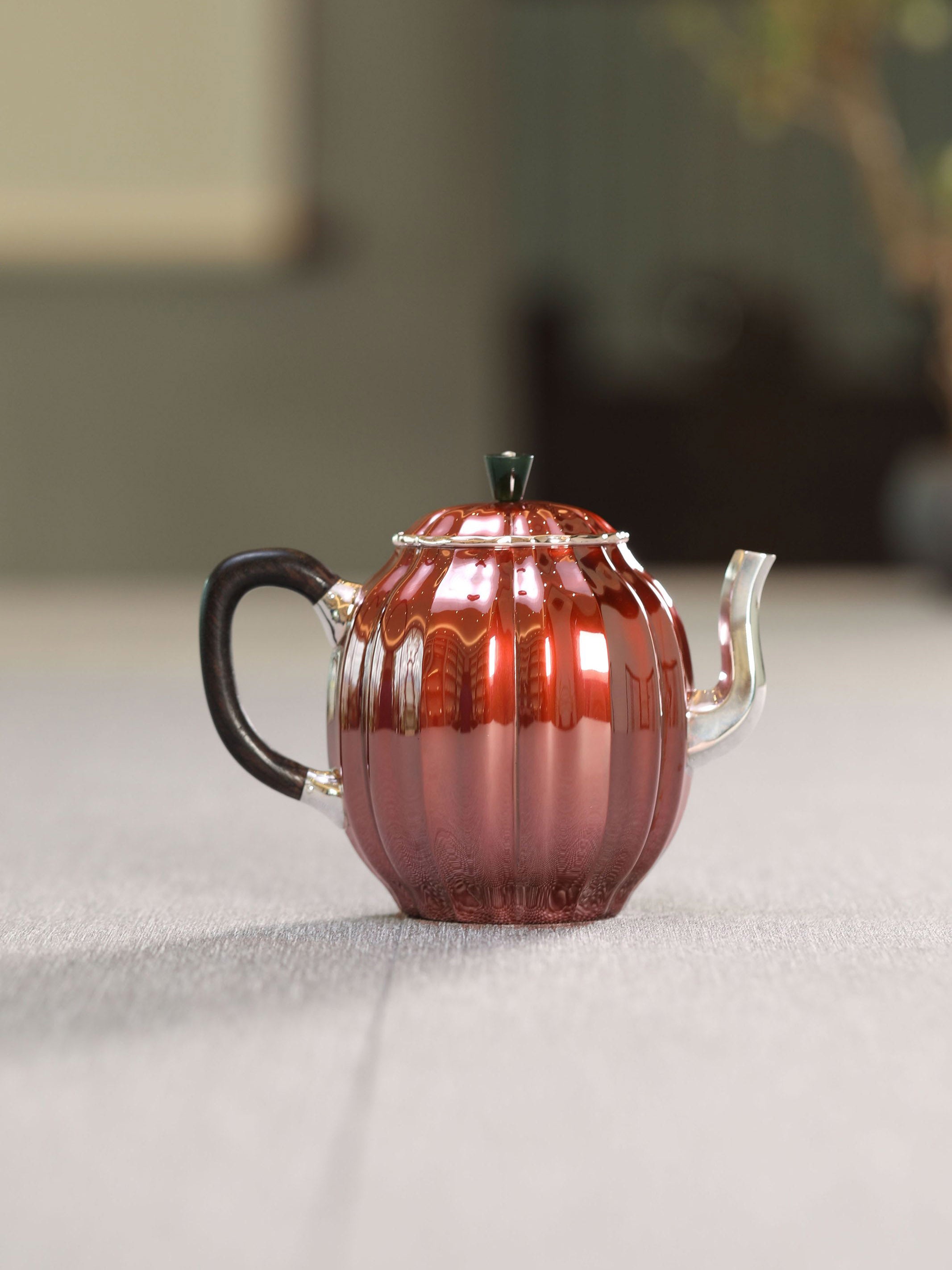 Diamond-shaped sterling silver teapot