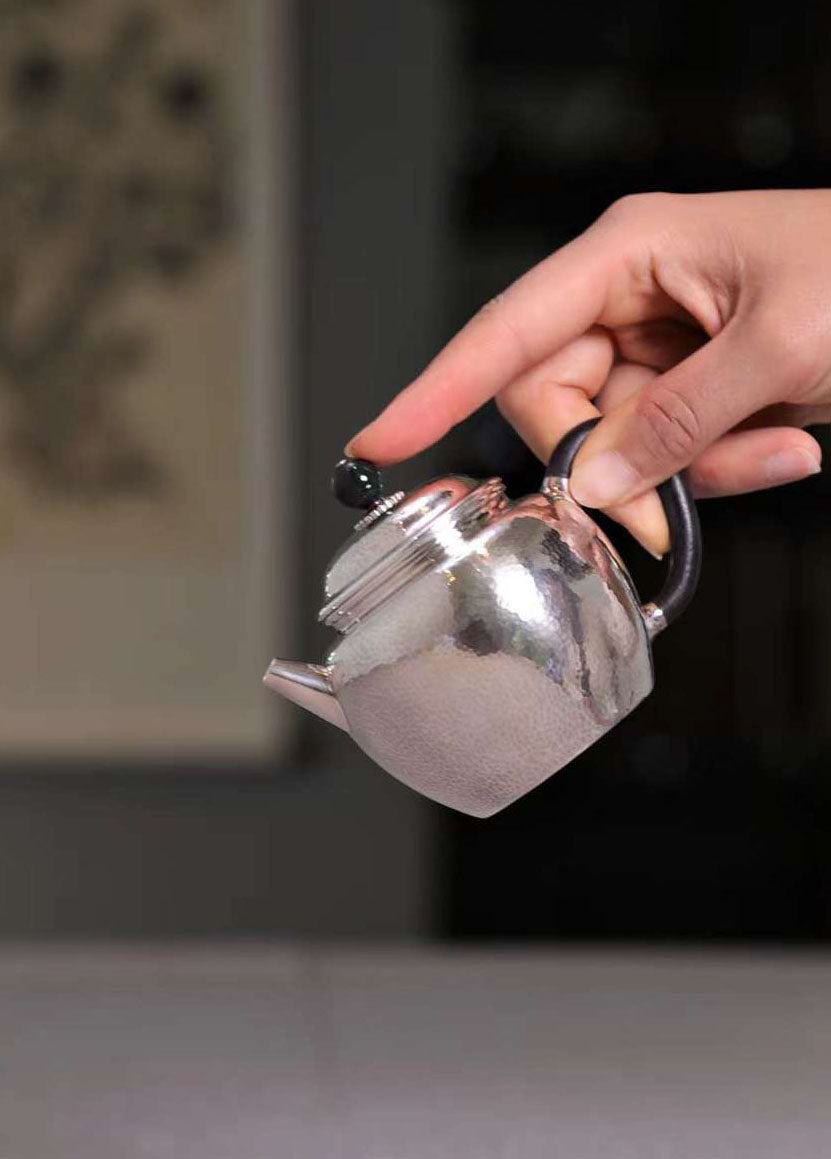 掇只纯银泡壶
