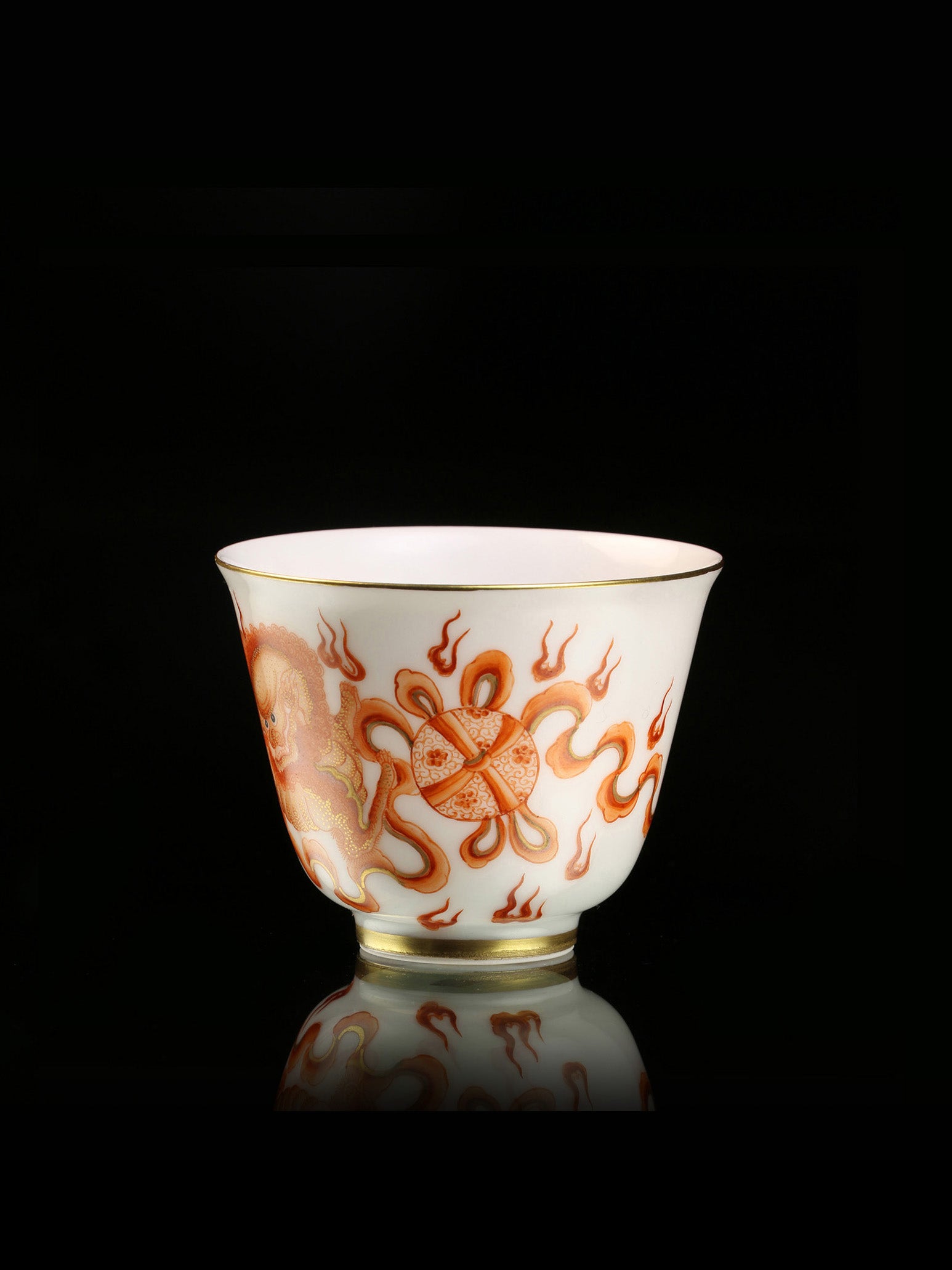 Iron-Red Tasting Cup with Gilded Lion Dance & Great Auspiciousness Motifs