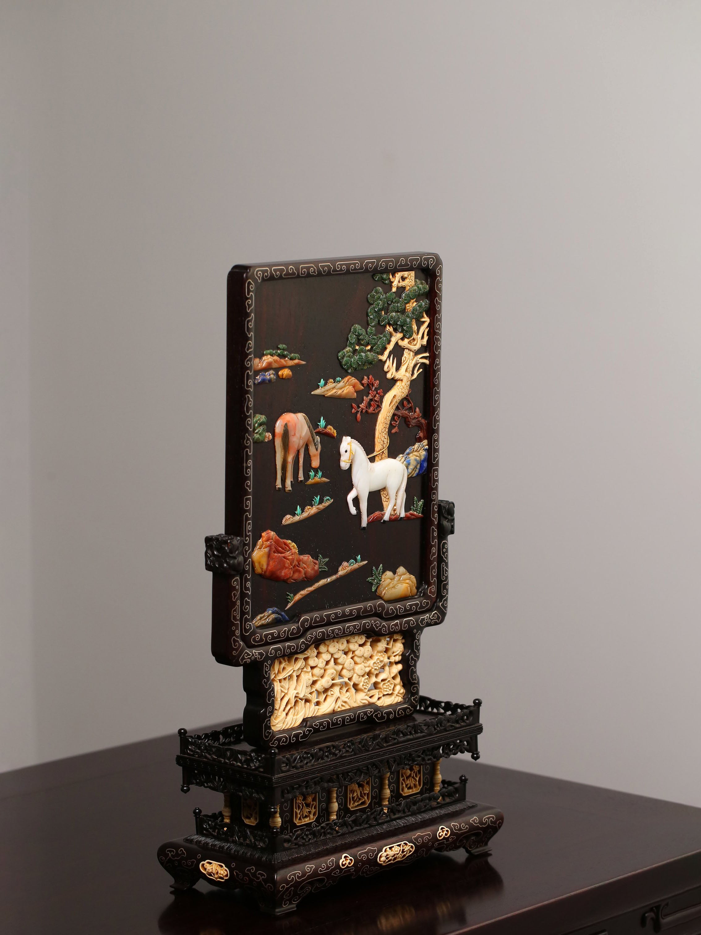 Rosewood screen inlaid with precious stones and mammoth ivory